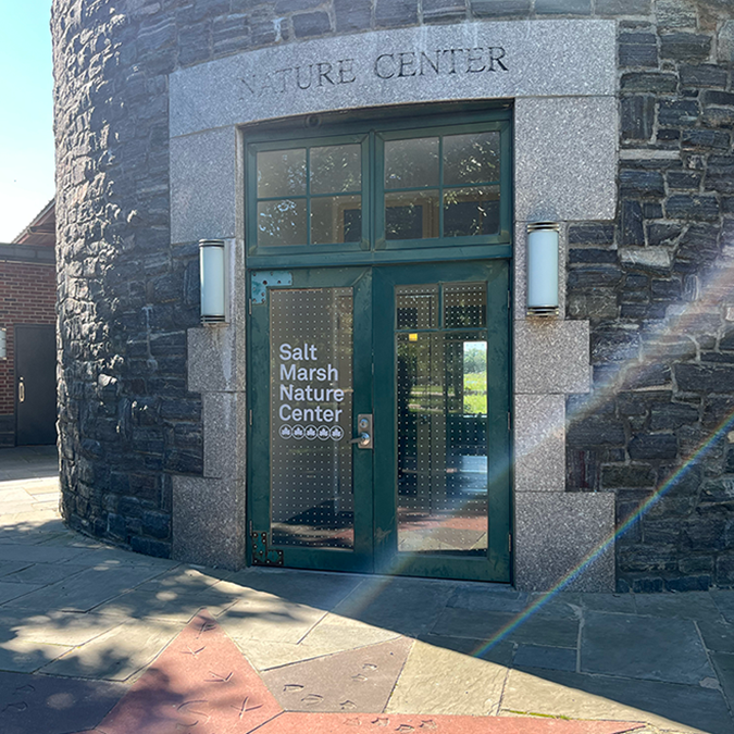 bird-friendly decals on the glass at the entrance to a freshly renovated nature center at Marine Park, Brooklyn
